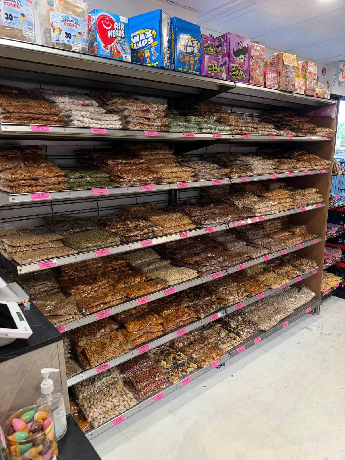 Shelves of freshly roasted nuts and snack mixes