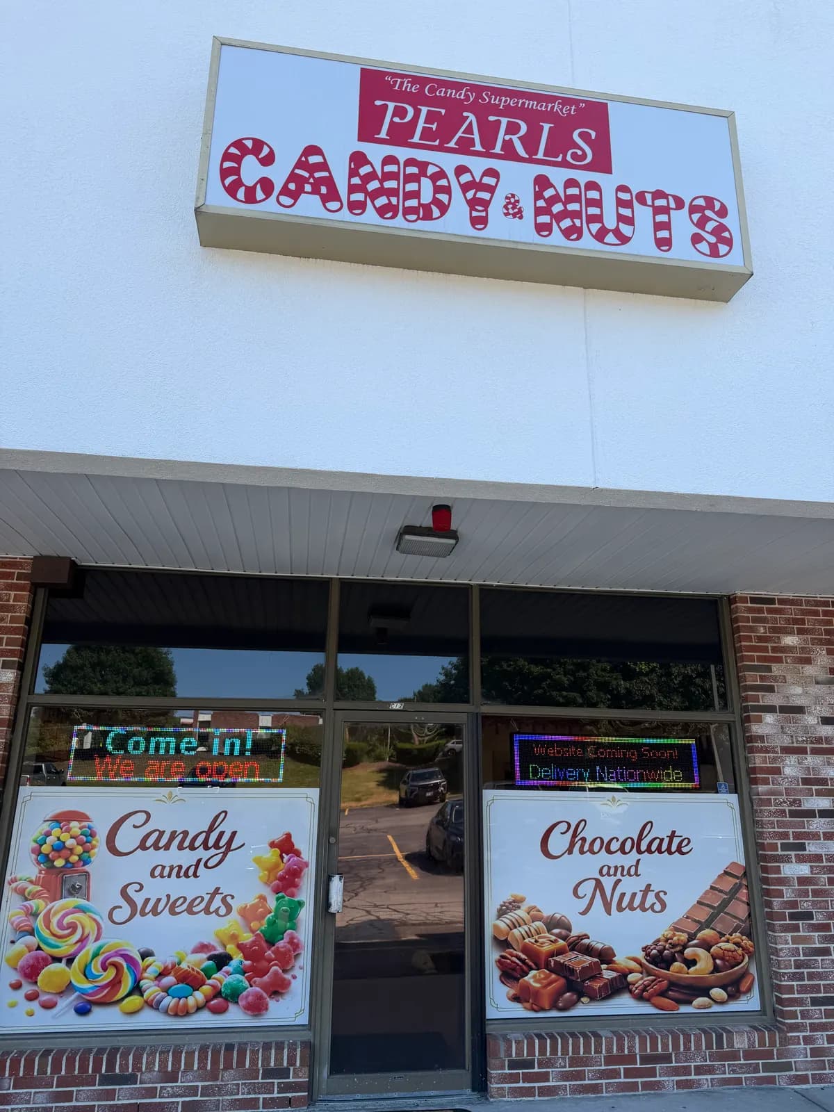 The Pearl's Candy & Nuts storefront in Bellingham, Massachusetts
